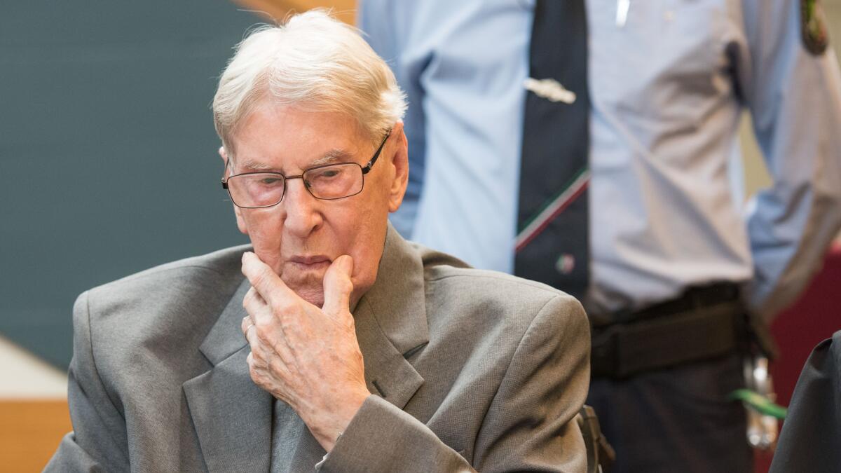 Former SS sergeant Reinhold Hanning, 94, who served as a guard at Auschwitz, sits in the courtroom in Detmold, Germany on Friday.