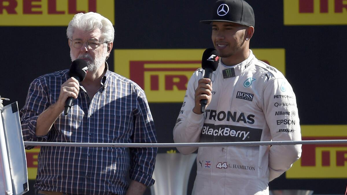 George Lucas interviews Formula One driver Lewis Hamilton after he won the Italian Grand Prix on Sunday in Monza.