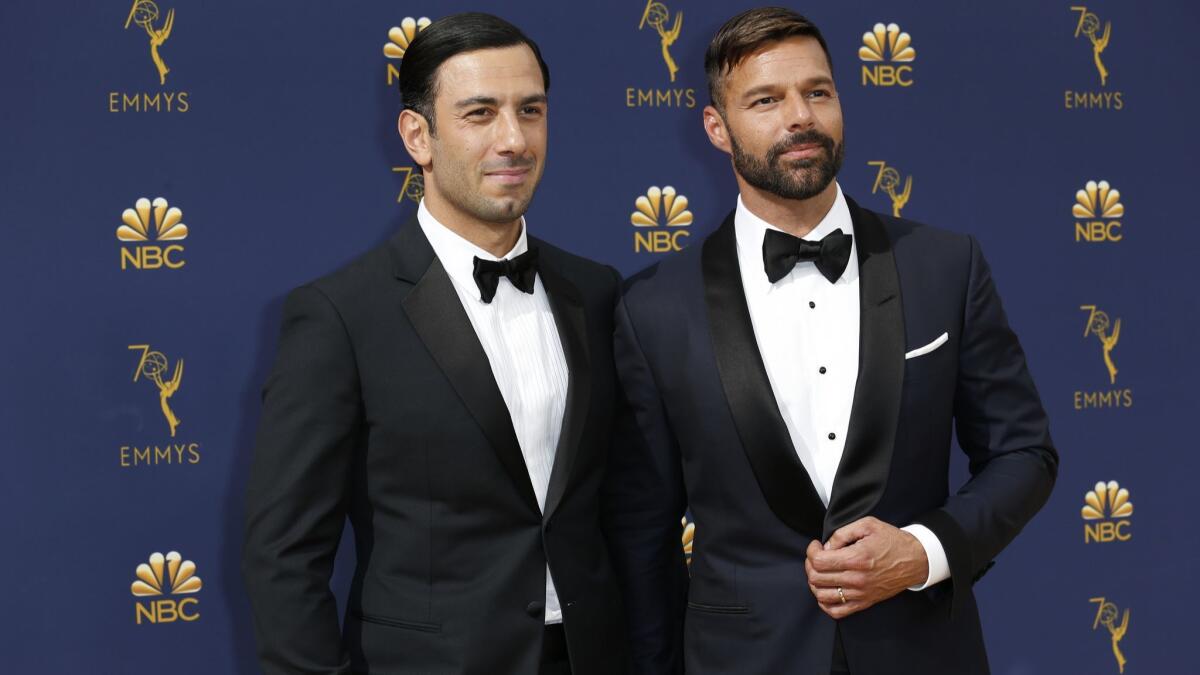Jwan Yosef, left, and husband Ricky Martin arrive at the 70th Primetime Emmy Awards at the Microsoft Theater in Los Angeles.