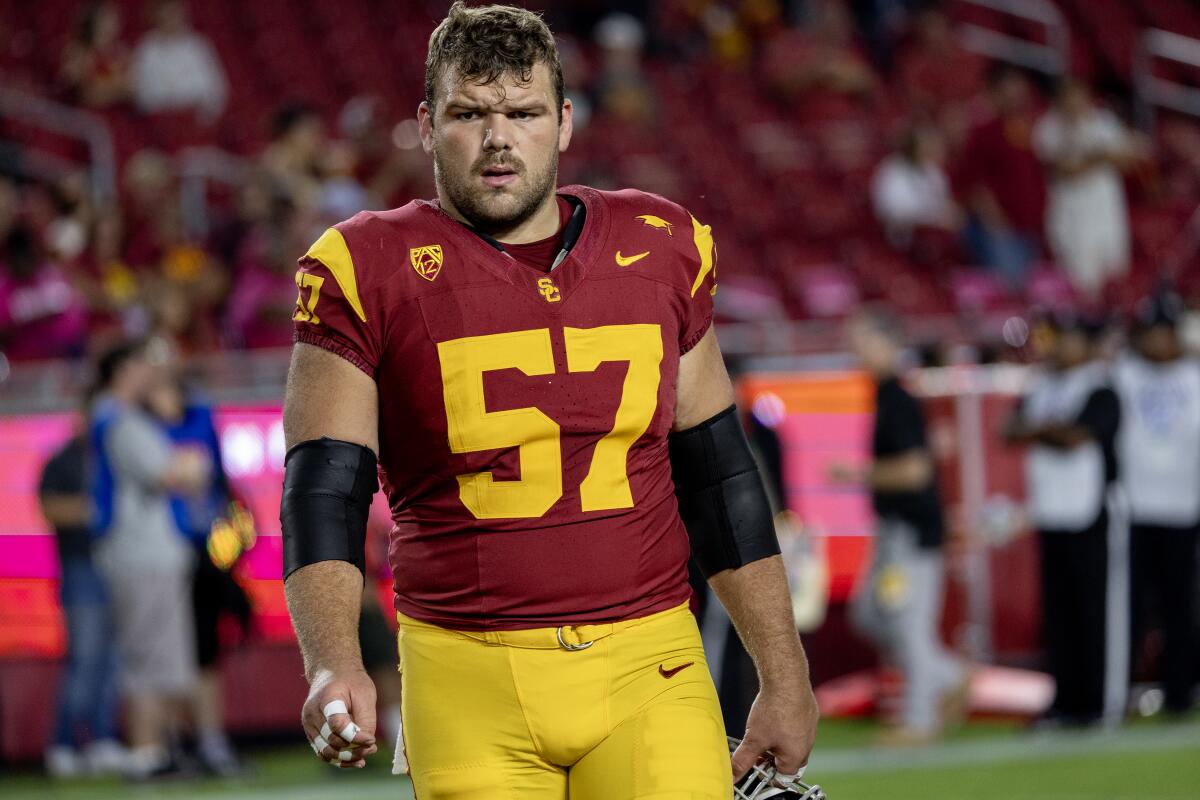 USC offensive lineman Justin Dedich stands on the field during warmups before a game against Arizona on Oct. 7.
