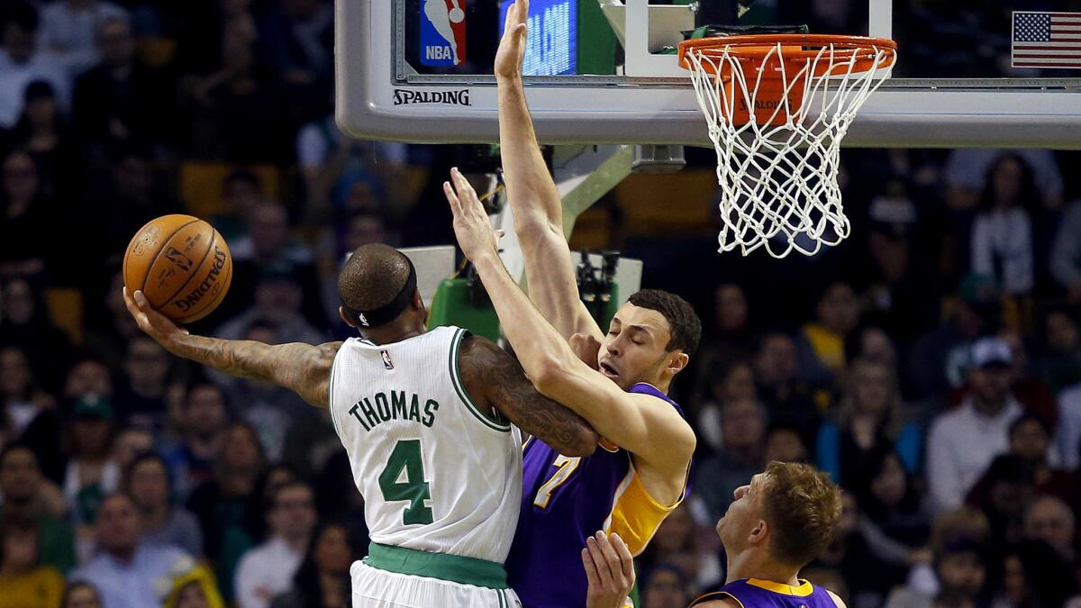 Lakers forward Larry Nance Jr. tries to stop Celtics guard Isaiah Thomas on a drive to the basket during the second half Friday night.