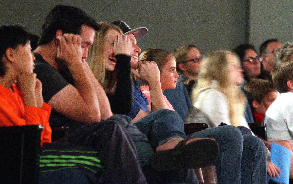 Some audience members react with laughter as during a comedy skit at a ComedySportz improv comedy challenge in the MacDonald Auditorium at Crescenta Valley High School on Friday, April 15, 2016.
