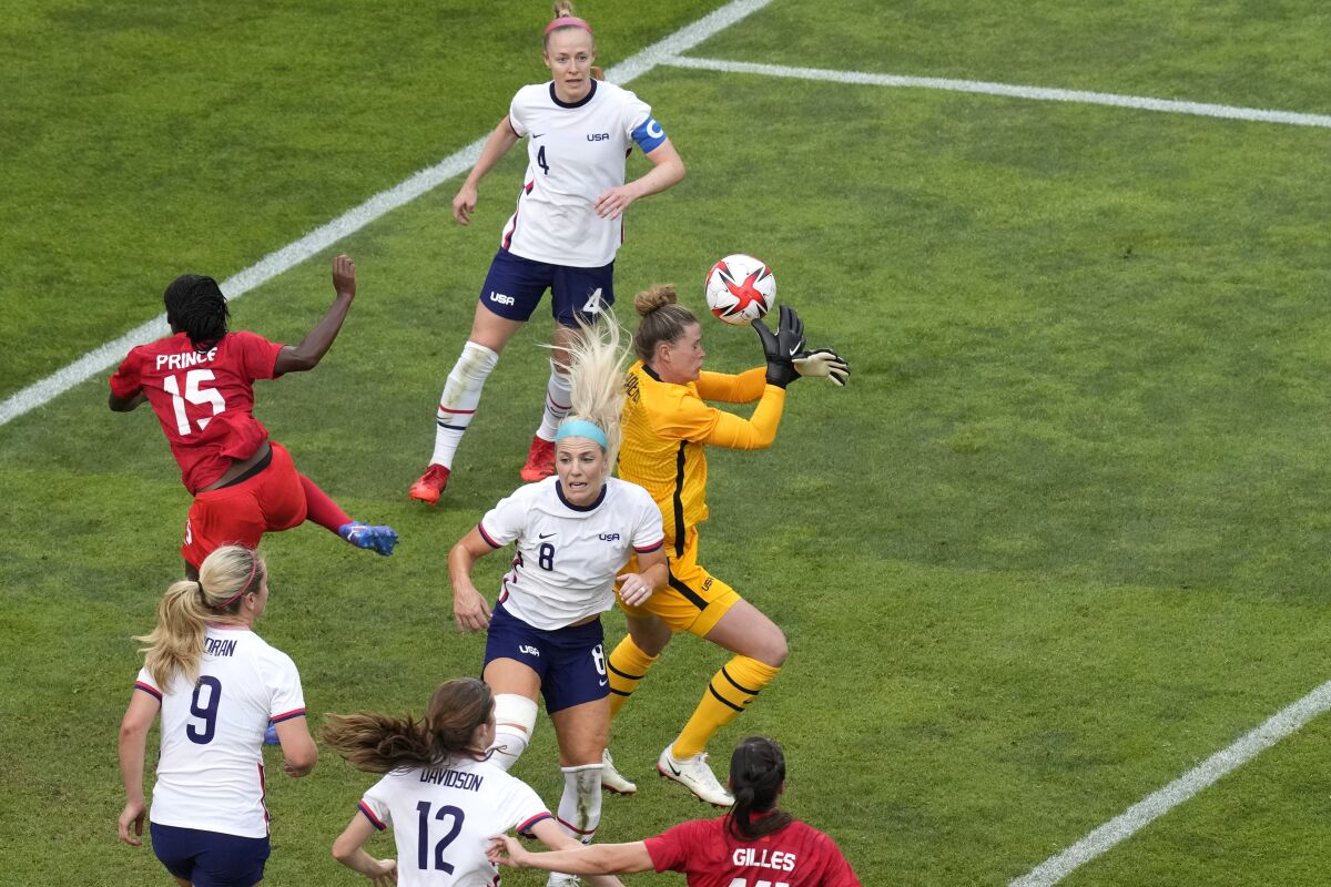 United States' goalkeeper Alyssa Naeher, right, catches a ball during a women's semifinal soccer match against Canada at the 2020 Summer Olympics, Monday, Aug. 2, 2021, in Kashima, Japan. (AP Photo/Martin Mejia)