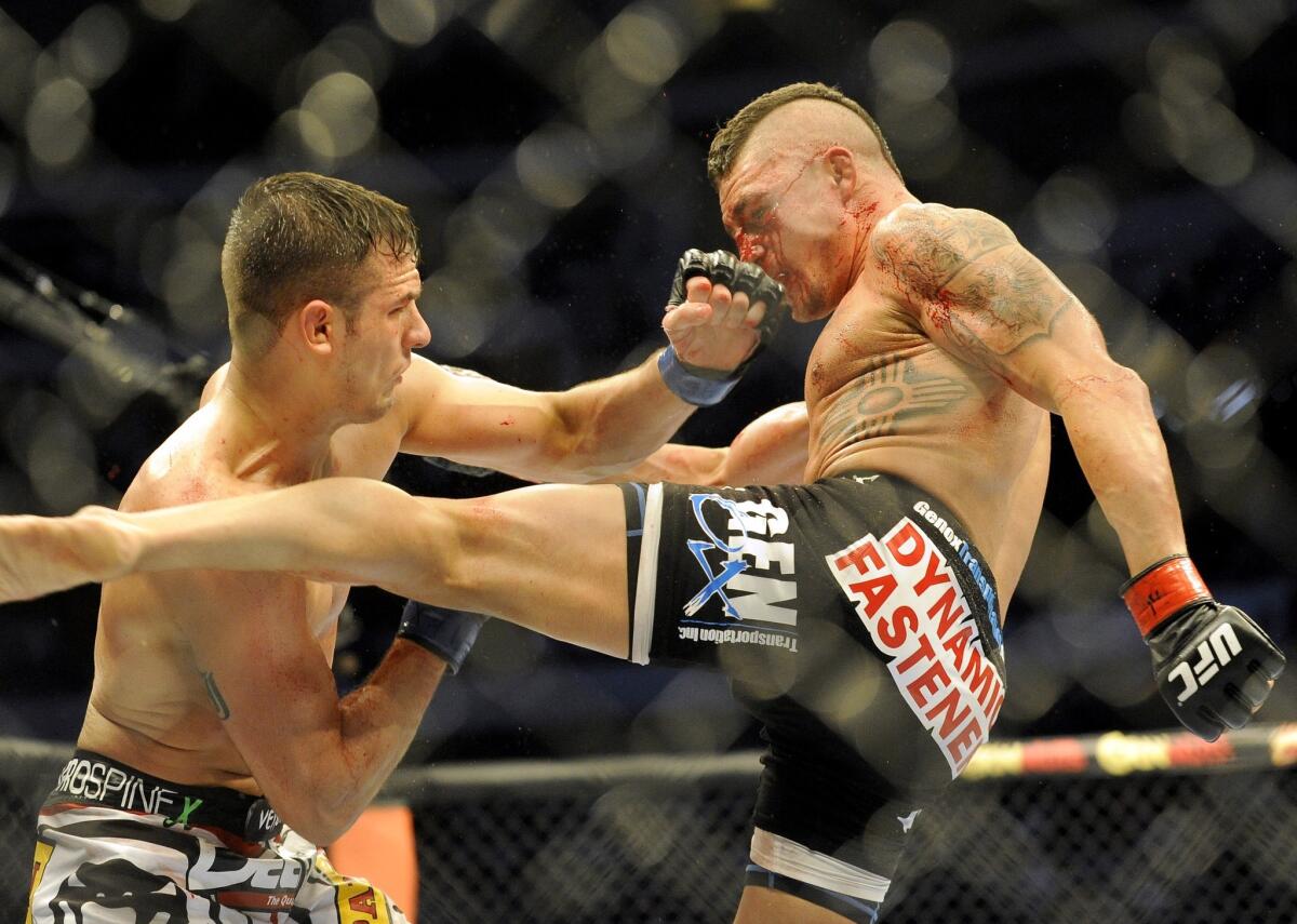 Myles Jury lands a punch on Diego Sanchez on his way to a unanimous decision on March 15, 2014.