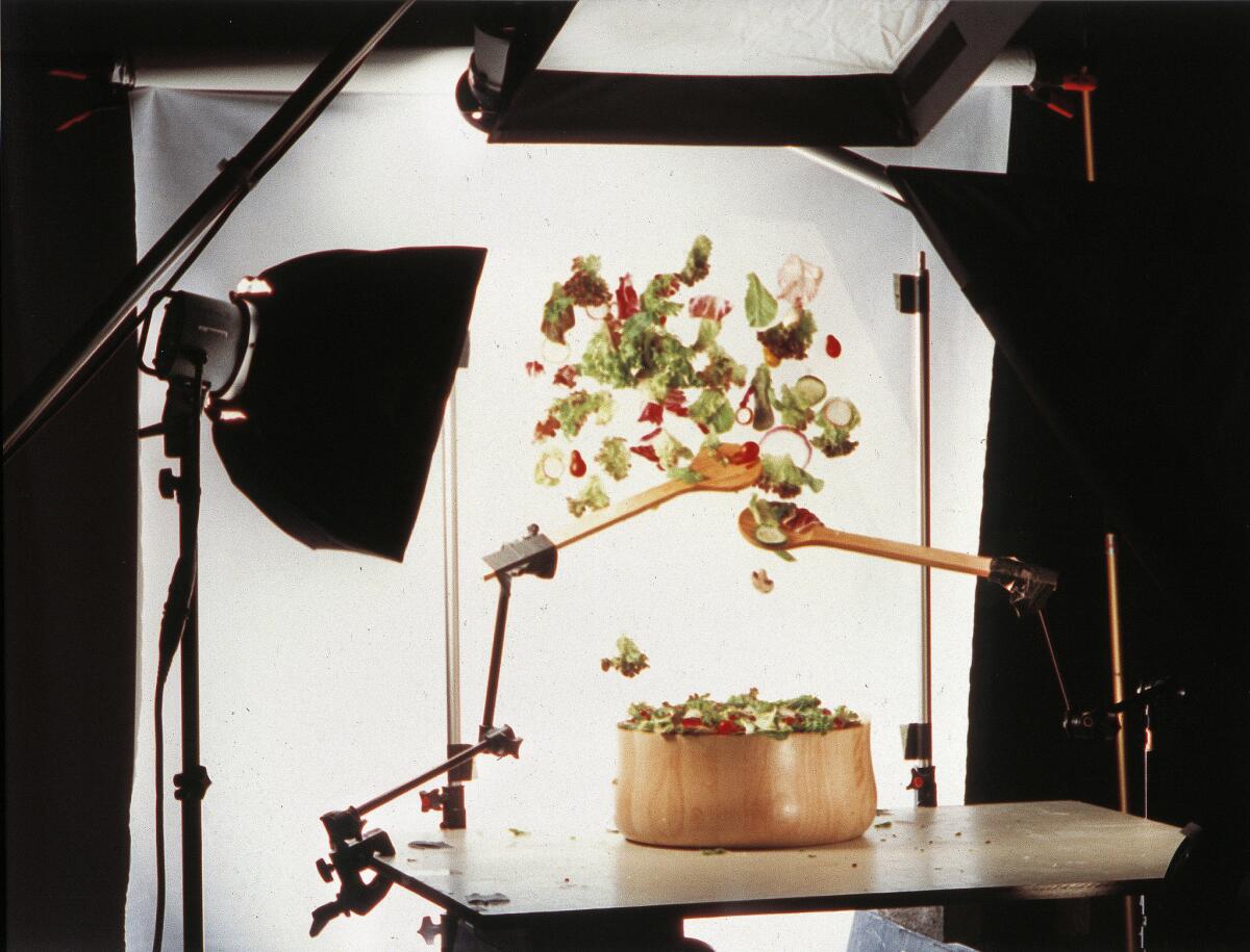 Photo shoot for tossing a salad.