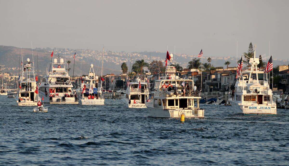 A large number of boats participate in the War Heroes on Water boat parade in Newport Harbor on Thursday.
