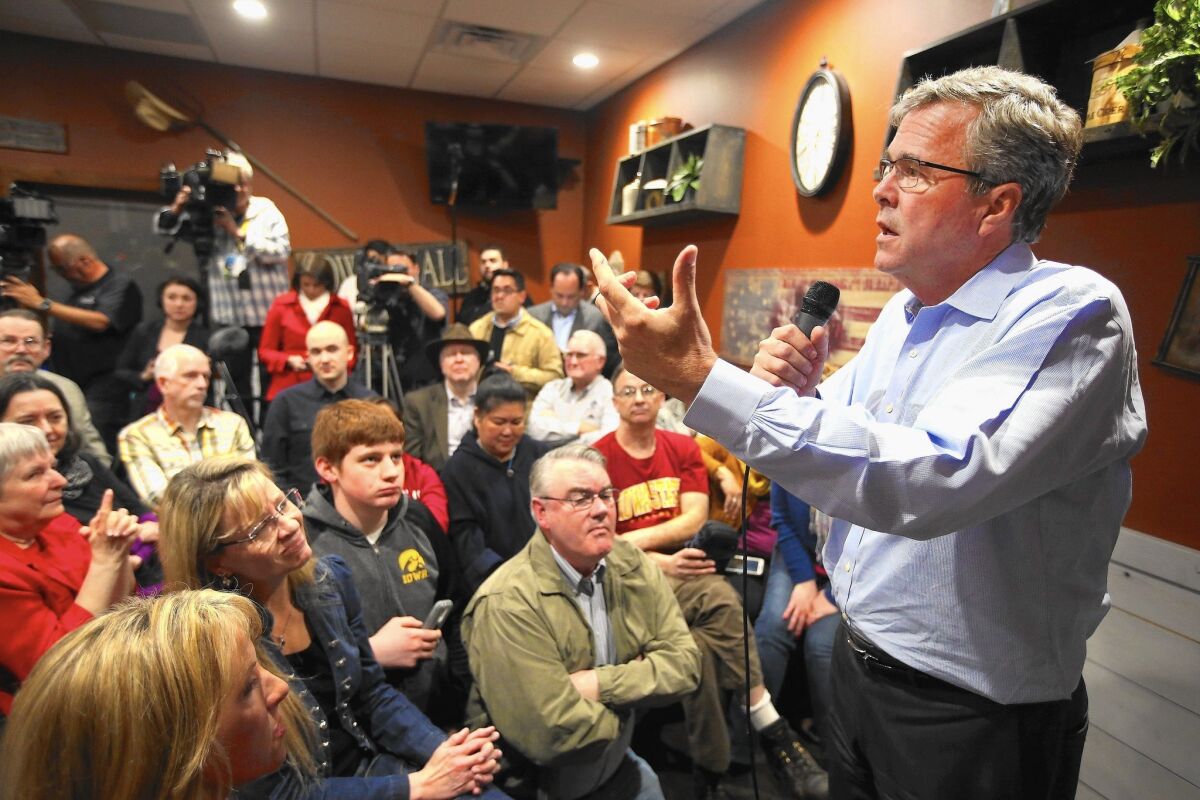 Former Florida Gov. Jeb Bush speaks to Iowa residents at a restaurant in Cedar Rapids.