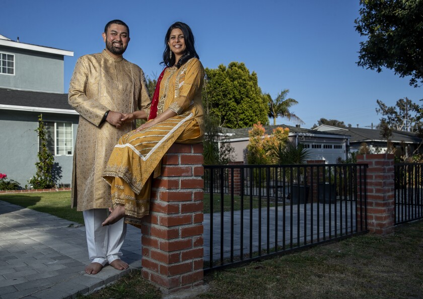 Adil Sheikh and his wife, Safia Sheikh, in front of their home in Los Angeles