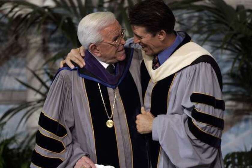 Robert A. Schuller, right, with his dad, Robert H. Schuller, at a Chrystal Cathedral service Jan. 1, 2006, in Garden Grove.