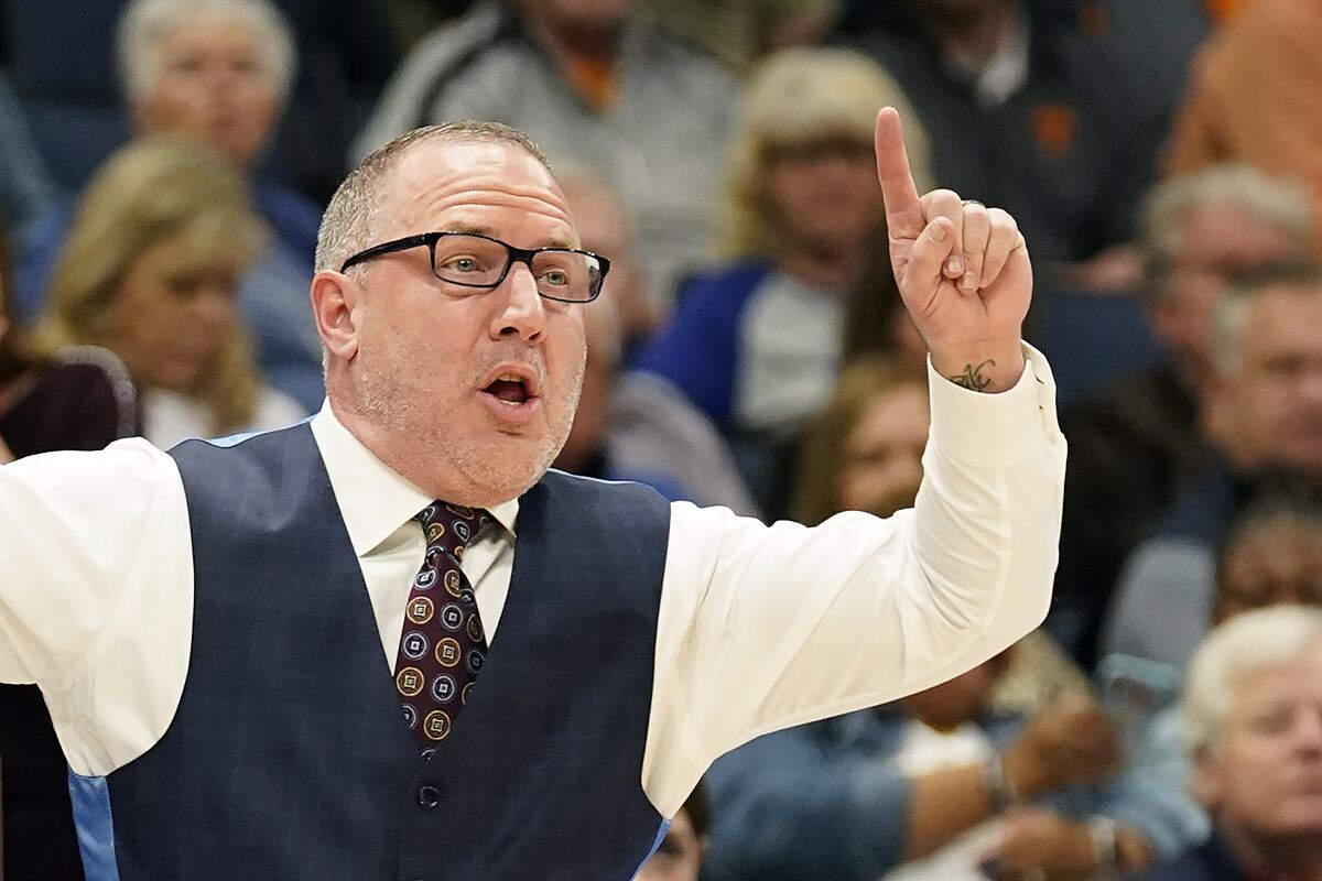 Texas A&M head coach Buzz Williams calls a play against Tennessee during the first half of an NCAA men's college basketball Southeastern Conference tournament championship game Sunday, March 13, 2022, in Tampa, Fla. (AP Photo/Chris O'Meara)