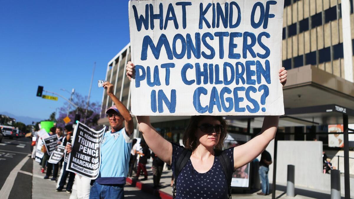 Protesters demonstrate against the separation of migrant children from their families in front of the federal building in downtown Los Angeles on June 18.