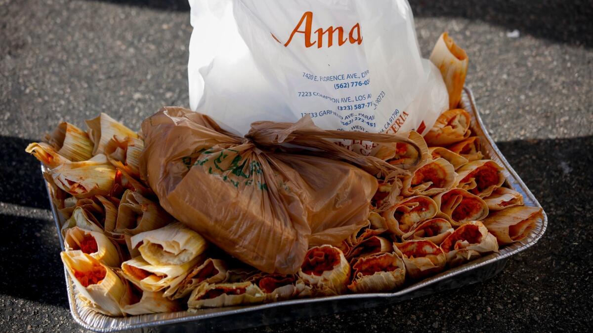 An aluminum pan full of ruined tamales outside Amapola Deli and Market in Downey.