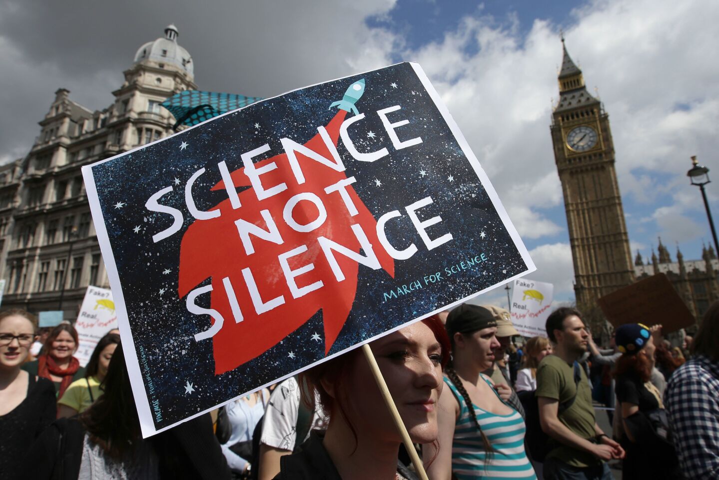 The March for Science in London passes Big Ben and Parliament.