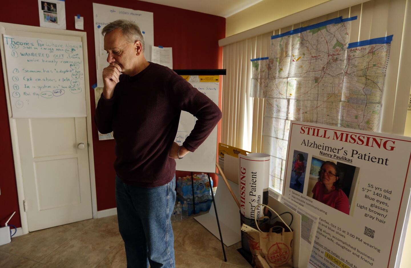 Kirk Moody is surrounded by maps and posters from the effort to find his wife, Nancy Paulikas, suffering from Alzheimer's disease and missing since Oct. 15, 2016.