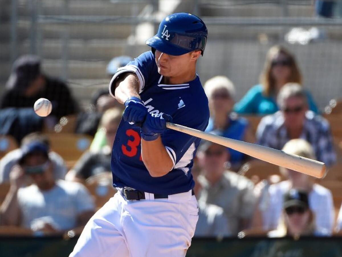 Dodgers prospect Joc Pederson swings at a pitch in the spring training opener.