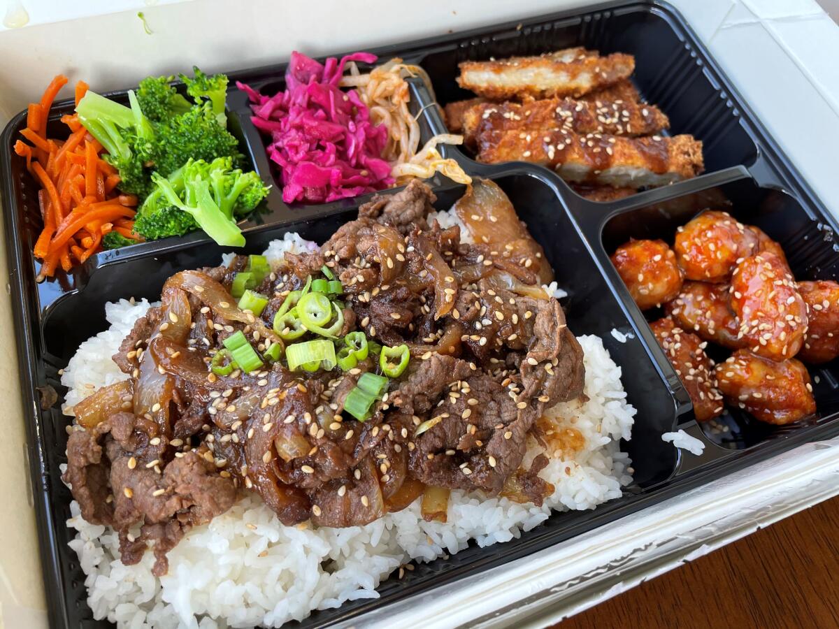 The Goban’s Supreme Combo Box with grilled beef, deep-fried pork and Korean fried chicken.