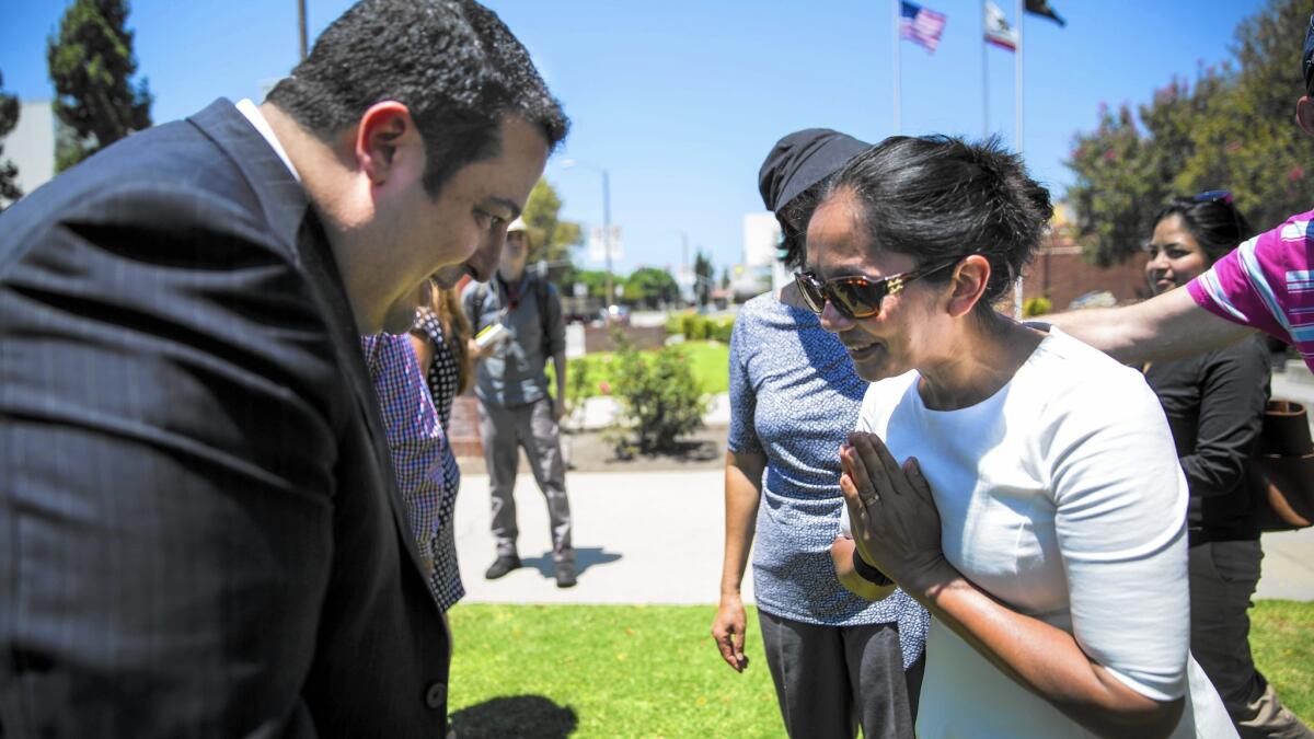 El Monte mayor Andre Quintero and Rotchana Sussman bow to each other after the kickoff of events commemorating the 20th anniversary of the rescue of Thai workers imprisoned as slaves.