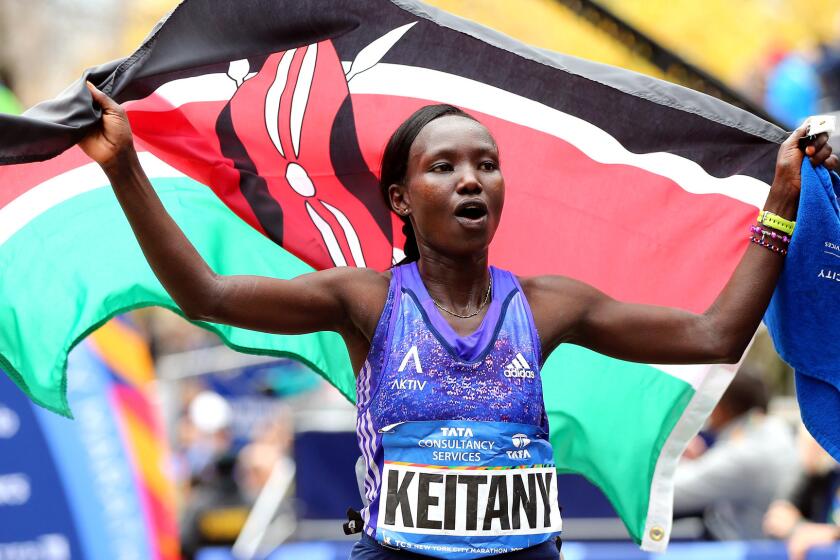 Kenyan Mary Keitany celebrates winning the women's title at the New York City Marathon on Sunday.