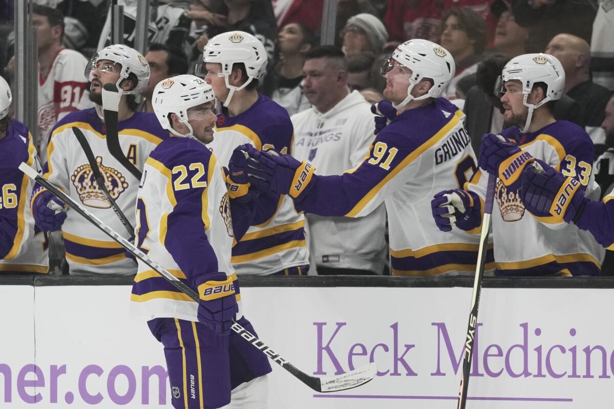 The Kings' Kevin Fiala (22) is congratulated by teammates after scoring during the first period Nov. 12, 2022.