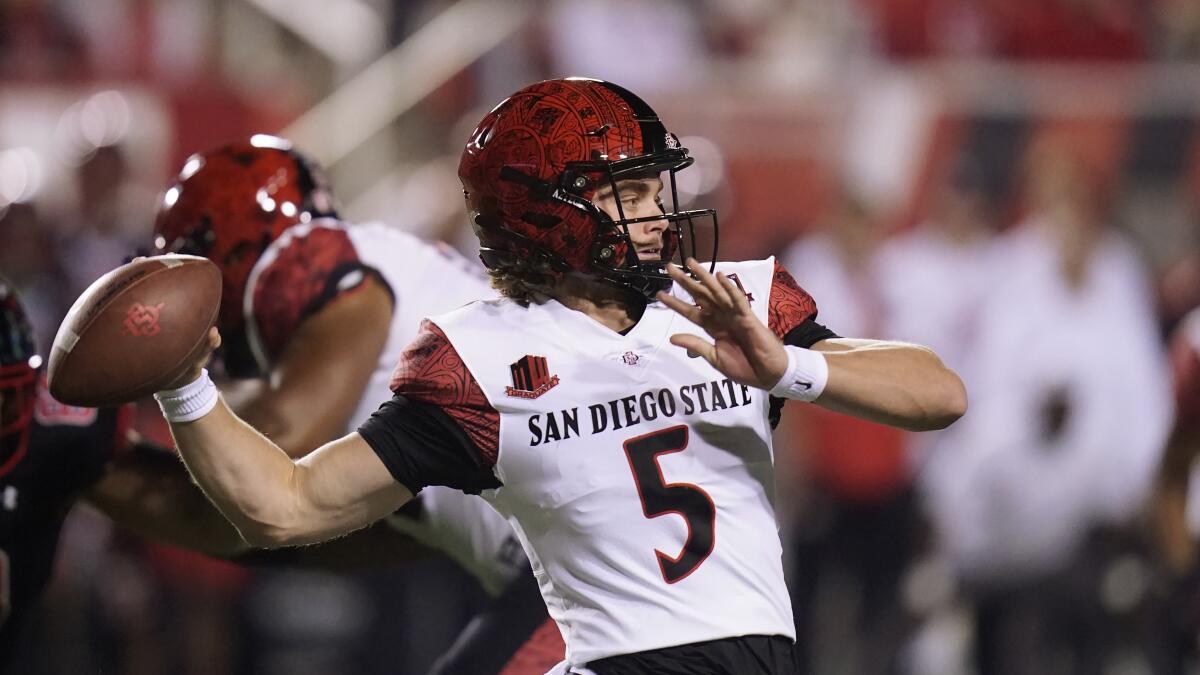 San Diego State quarterback Braxton Burmeister (5) throws against Utah during the first half of Saturday's game.