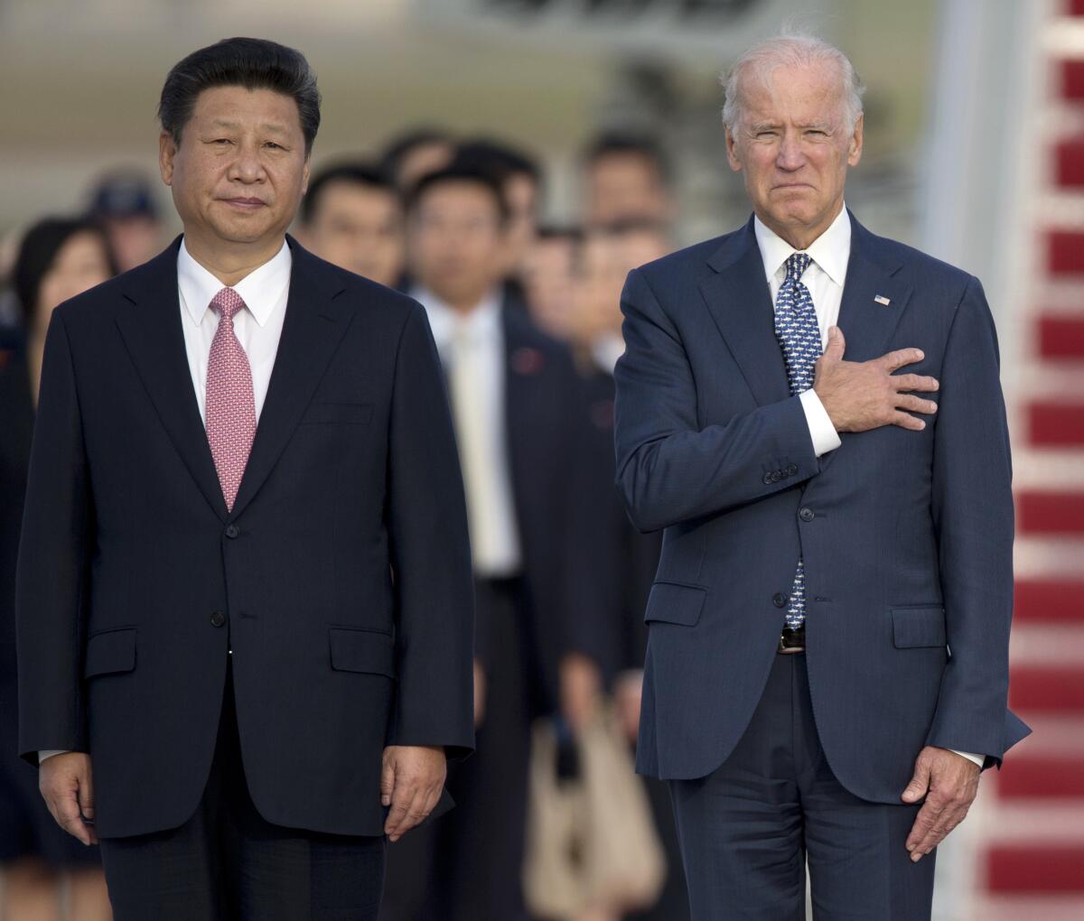 Chinese President Xi Jinping and President Joe Biden, then vice president, at Andrews Air Force Base, Md. in September 2015.