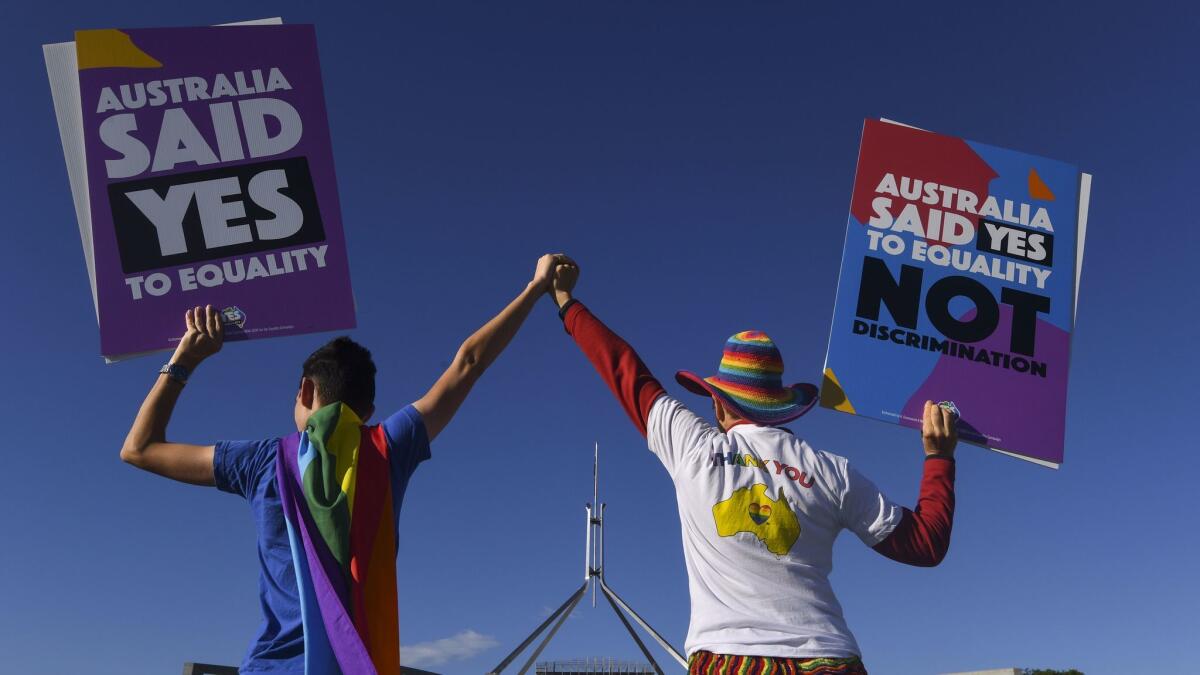 Same-sex marriage campaigners rally outside Parliament House in Canberra, Australia, on Dec. 7.