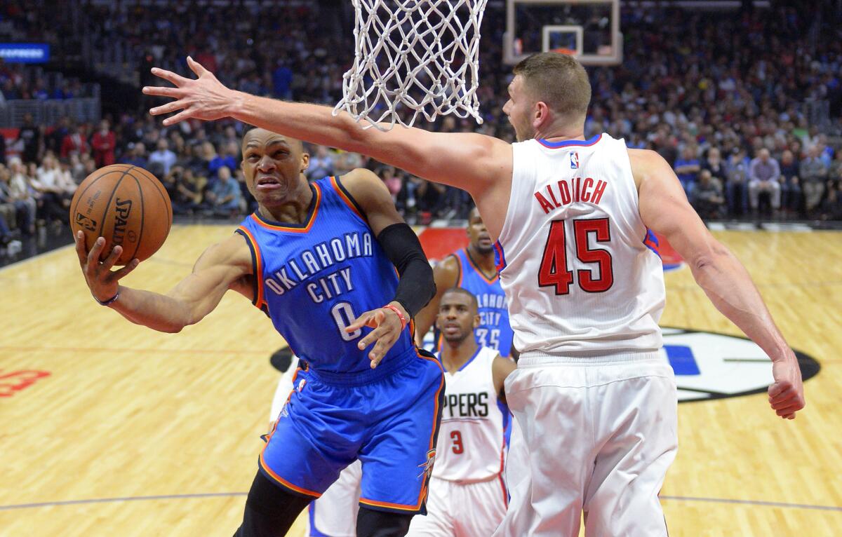 Thunder guard Russell Westbrook (0) shoots as Clippers center Cole Aldrich tries to block his shot during a game on March 2.
