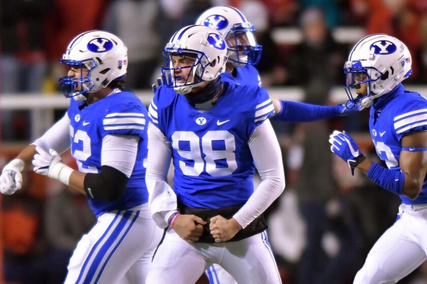 SALT LAKE CITY, UT - NOVEMBER 24: Mitch Harris #98 of the Brigham Young Cougars and teammates celebrate a fumble recovery against the Utah Utes in the first half of a game at Rice-Eccles Stadium on November 24, 2018 in Salt Lake City, Utah. (Photo by Gene Sweeney Jr/Getty Images) ** OUTS - ELSENT, FPG, CM - OUTS * NM, PH, VA if sourced by CT, LA or MoD **