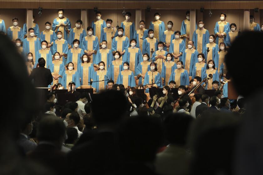 Members of the choir wearing face masks to help protect against the spread of the new coronavirus attend a service at the Yoido Full Gospel Church in Seoul, South Korea, Sunday, May 31, 2020. (AP Photo/Ahn Young-joon)