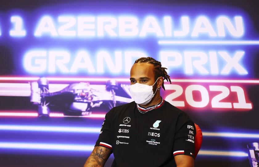 Mercedes driver Lewis Hamilton of Britain speaks during a media conference ahead of the Formula One Grand Prix at the Baku Formula One city circuit in Baku, Azerbaijan, Thursday, June 3, 2021. The Azerbaijan Formula One Grand Prix will take place on Sunday. (Francois Nel, Pool via AP)