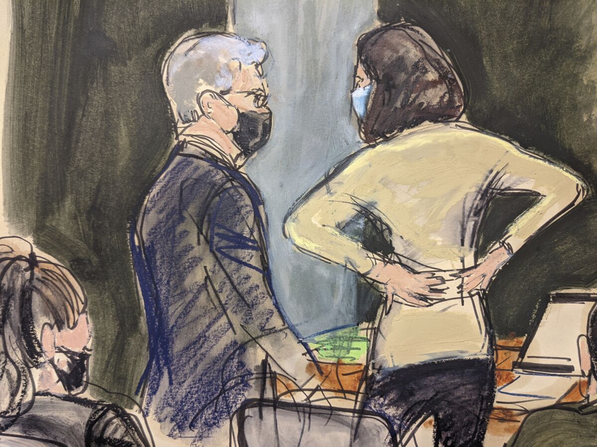 In this courtroom sketch, defense attorney Jeffrey Pagliuca, left, confers with Ghislaine Maxwell after making an argument to Judge Nathan regarding the removal of a juror due to holiday travel plans that would disrupt the trial schedule during Maxwell's sex trafficking trial, Tuesday, Nov. 30, 2021, in New York. A longtime pilot for the late financier Jeffrey Epstein resumed his testimony at Ghislaine Maxwell's sex trafficking trial Tuesday, saying that the British socialite charged with helping the financier find teenage girls to sexually abuse was "Number 2" in the hierarchy of Epstein's operations. (AP Photo/Elizabeth Williams)