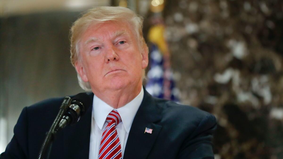 President Trump speaks to the media in the lobby of Trump Tower on Aug. 15.