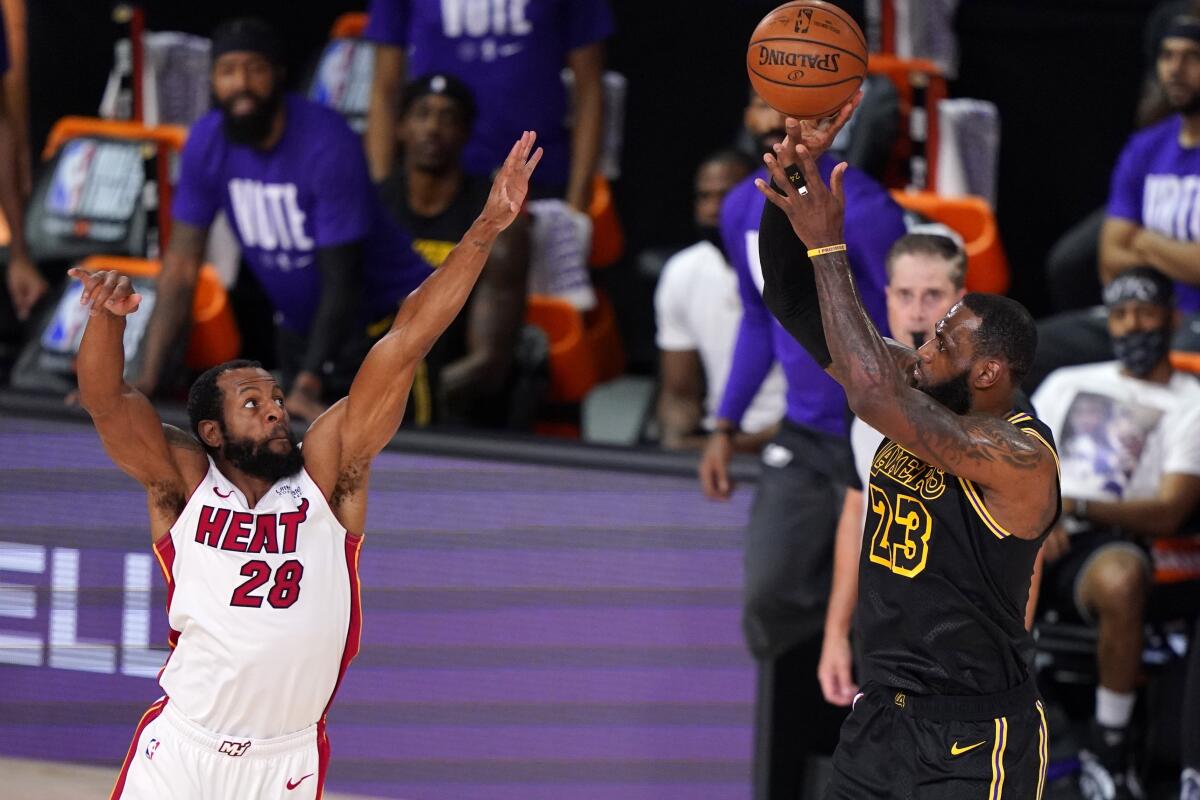 Lakers forward LeBron James puts up a shot against Heat forward Andre Iguodala during Game 2.