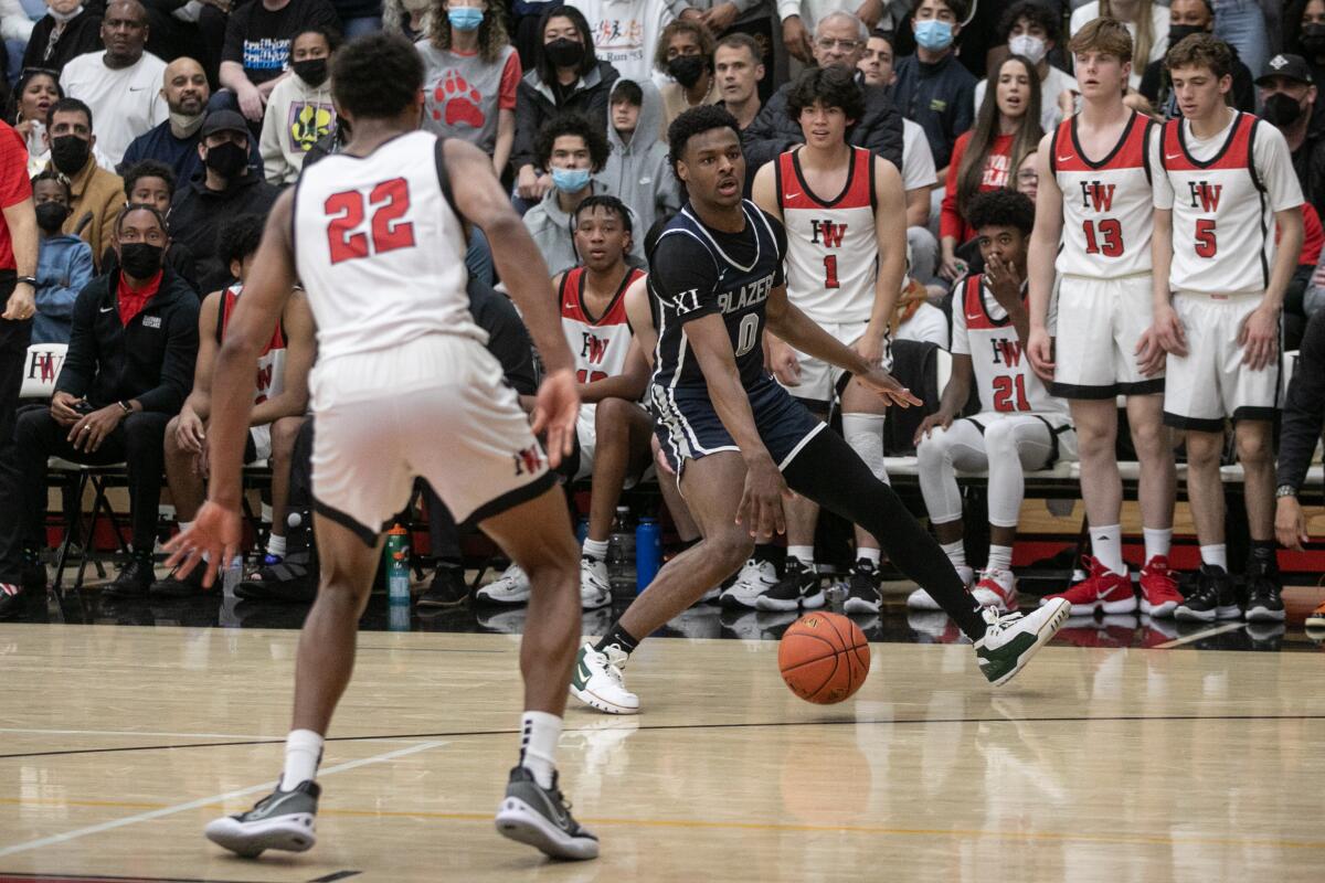 Sierra Canyon's Bronny James handles the ball against Harvard-Westlake in an Open Division regional semifinal playoff game.