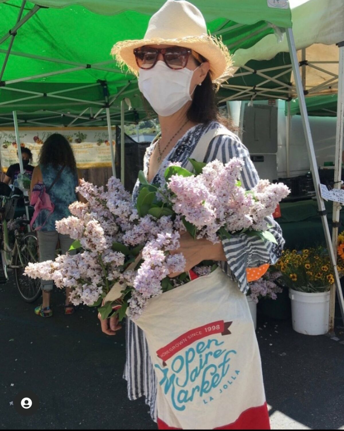 Masked guests can pick up produce, lunch, crafts or flowers from the La Jolla Open Aire Market.