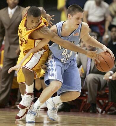 USC Trojans' Ryan Francis goes for the steal on North Carolina Tar Heels' Bobby Frasor.