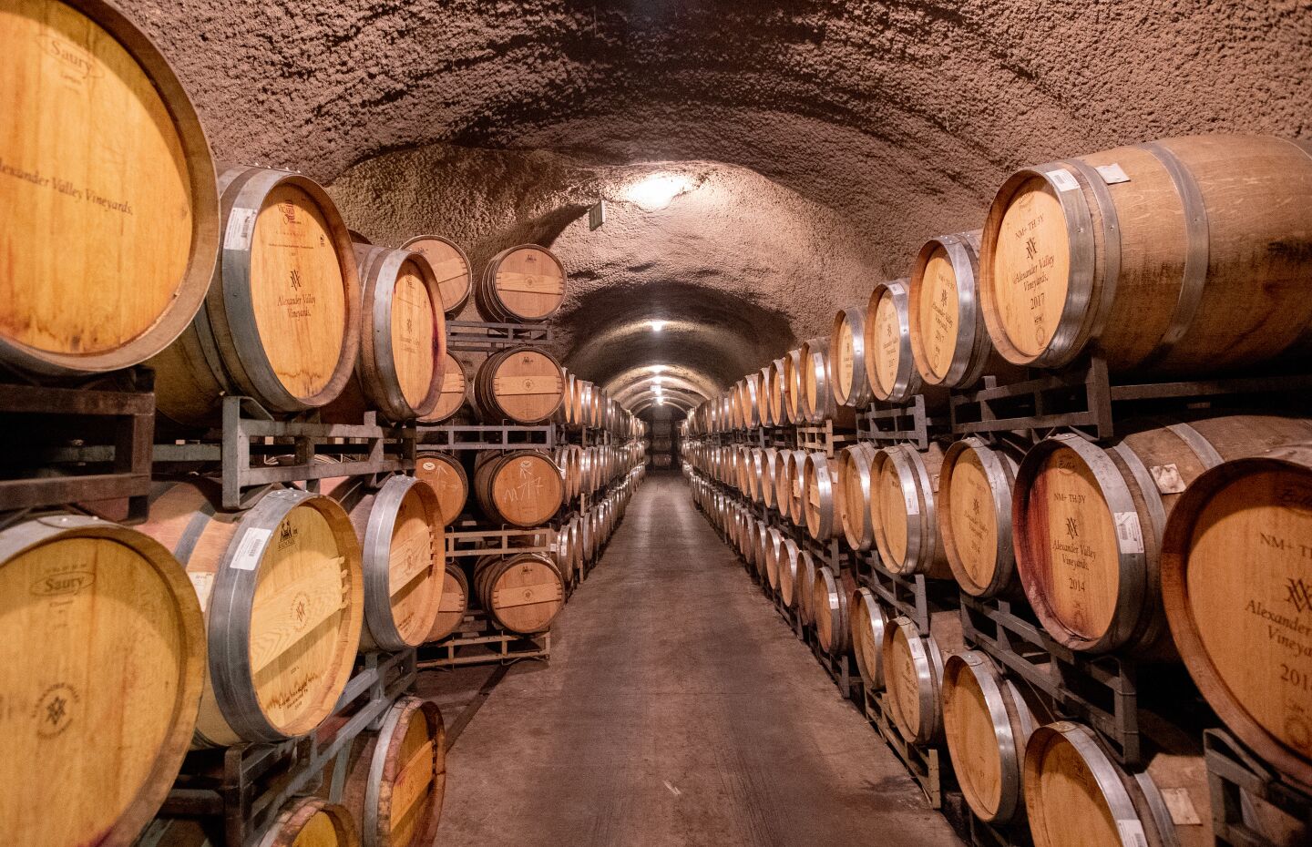 About 7,000 barrels of wine are stored in a cave at Alexander Valley Vineyards. California wineries face a 93% price increase because of taxes and retaliatory tariffs imposed by China amid the trade war.