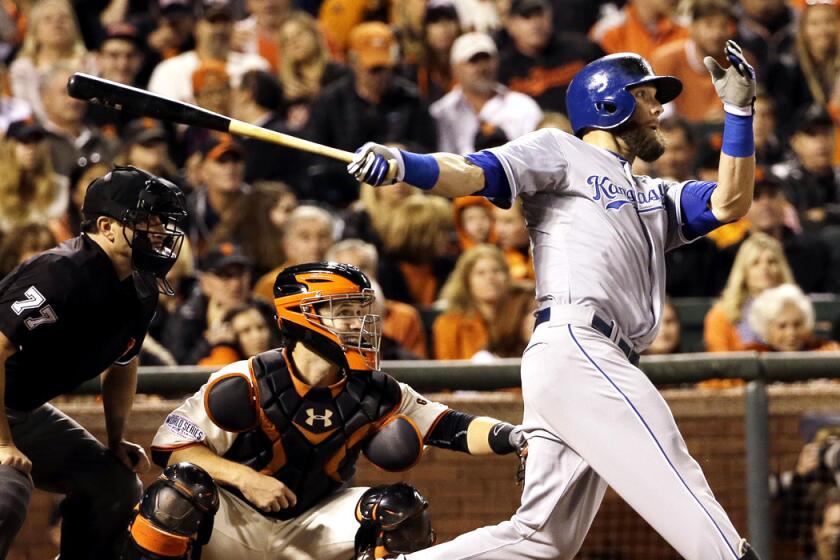 Royals left fielder Alex Gordon delivers a run-scoring double against the Giants in Game 3 of the World Series on Friday night in San Francisco.