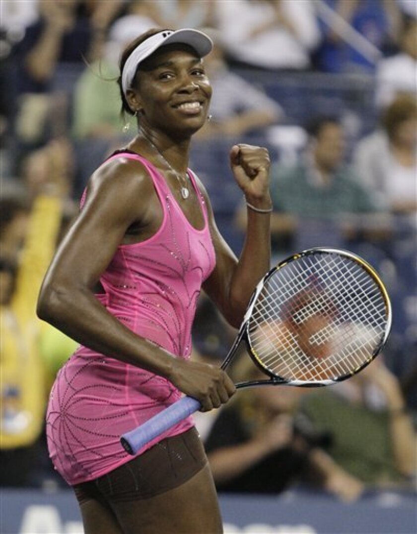 Venus Williams, of the United States, reacts after defeating Francesca Schiavone, of Italy, 7-6 (5), 6-4 in a quarterfinal at the U.S. Open tennis tournament in New York, Tuesday, Sept. 7, 2010. (AP Photo/Frank Franklin II)