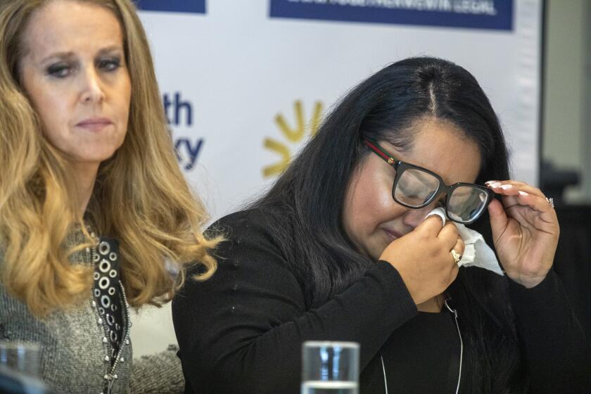 LOS ANGELES, CA - MAY 24: Attorney Jennifer J. McGrath, left, and Gabby speaks during a press conference at Luxe Sunset Boulevard Hotel, on Tuesday, May 24, 2022, in Los Angeles, CA. Attorneys representing 312 plaintiffs in sexual abuse lawsuits against the UC Regents and former UCLA gynecologist James Heaps will hold a news conference to announce what contact says is a settlement in the case. (Francine Orr / Los Angeles Times)