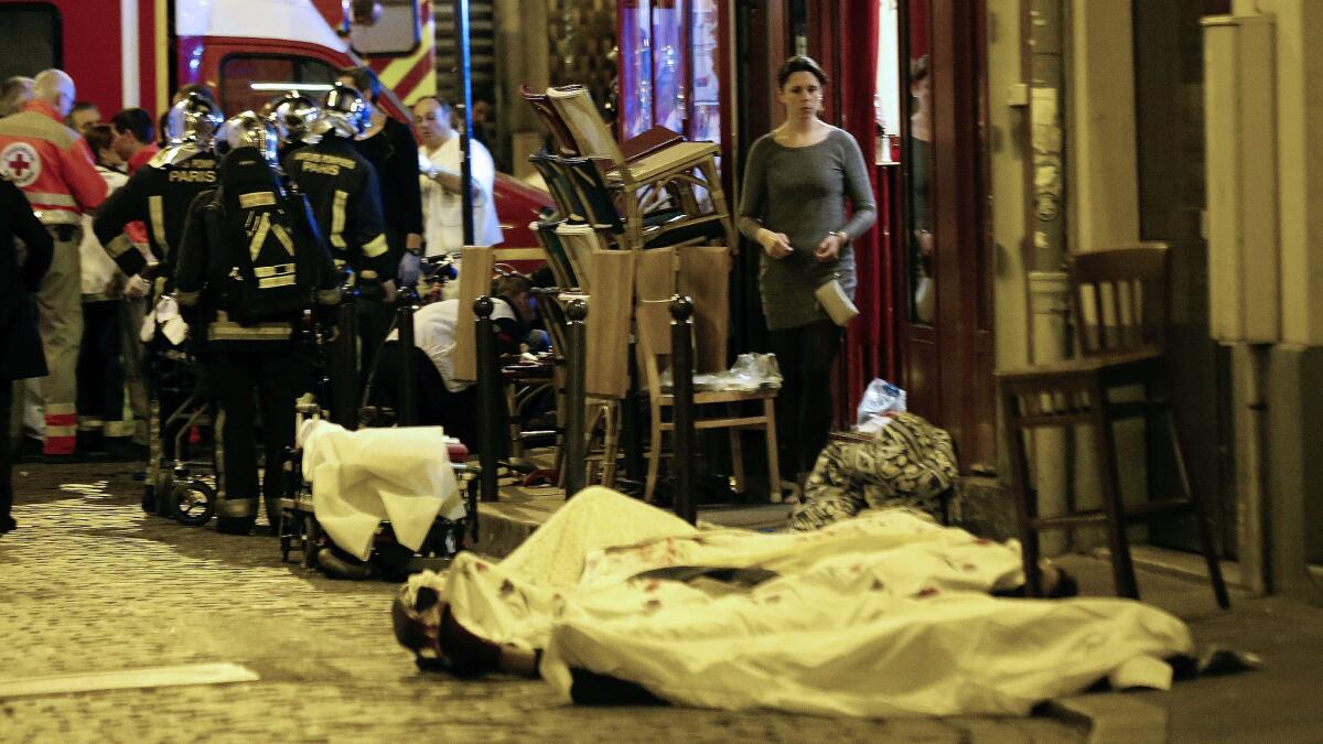 Victims on the pavement outside a Paris restaurant after one of the attacks around the city.