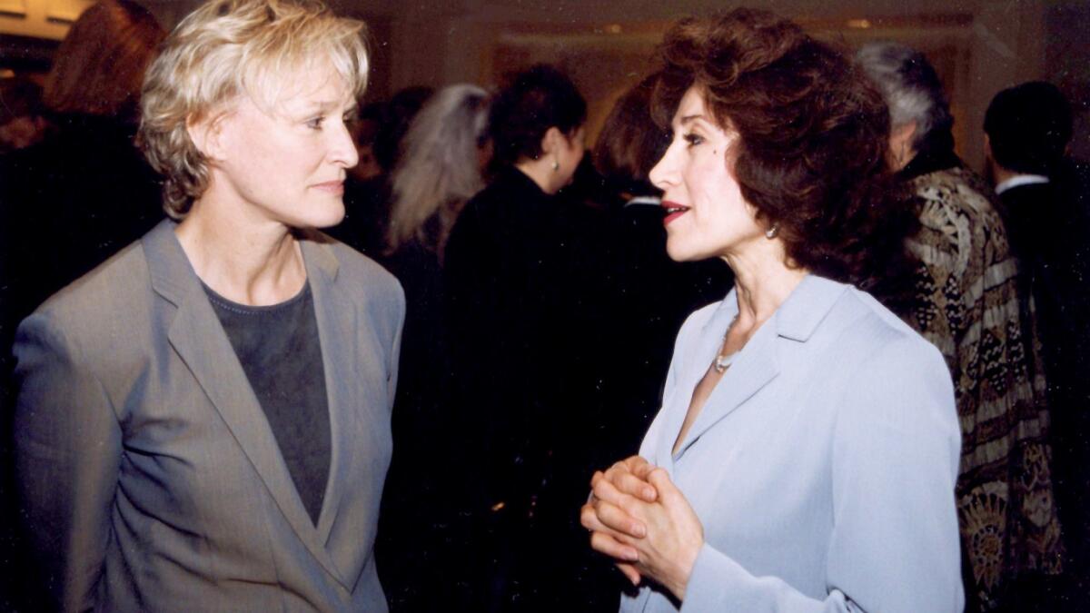 Sima Wali (right) talks with actress Glenn Close in 1999.