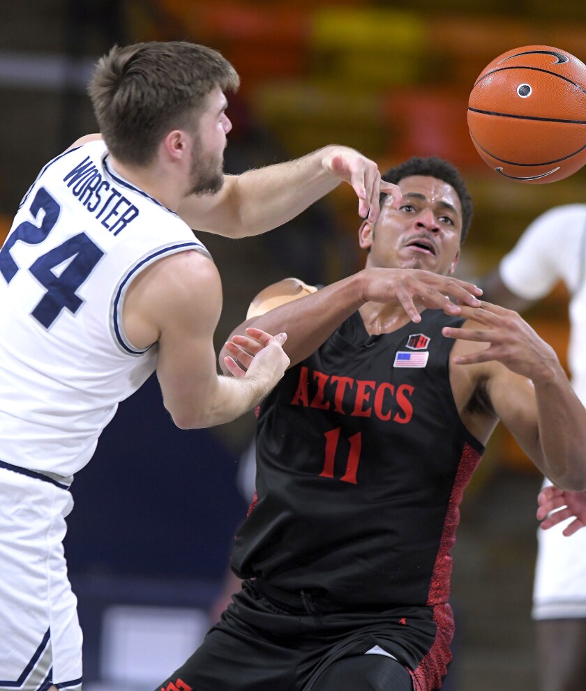 Utah State guard Rollie Worster (24) and San Diego State forward Matt Mitchell (11) go after a loose ball.