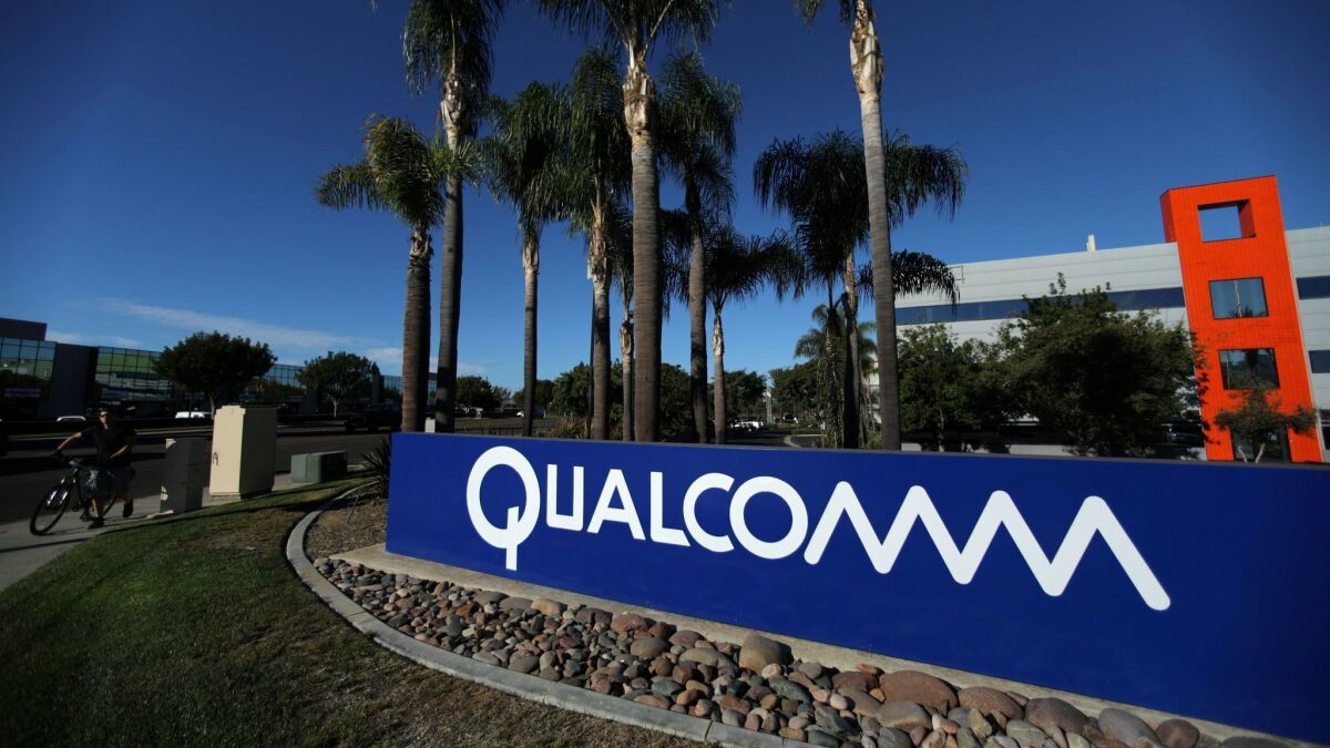 FILE PHOTO: A sign on the Qualcomm campus is seen in San Diego, California, U.S. November 6, 2017.
