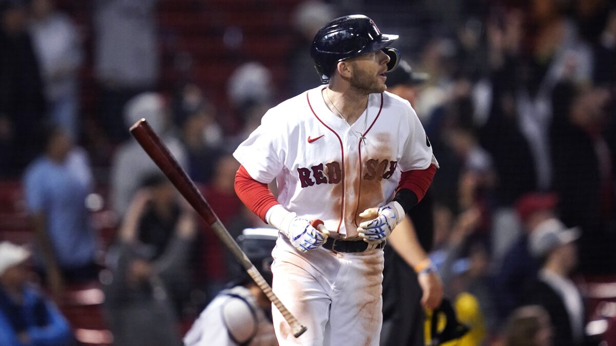 Boston Red Sox's Trevor Story tosses his bat while watching his three-run home run against the Seattle Mariners during the eighth inning of a baseball game at Fenway Park, Thursday, May 19, 2022, in Boston. Story hit two two-run home runs earlier in the game. (AP Photo/Charles Krupa)