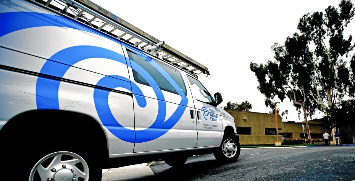 Time Warner Cable customer bills are going up again. Above, a TWC service truck in Carlsbad in May.