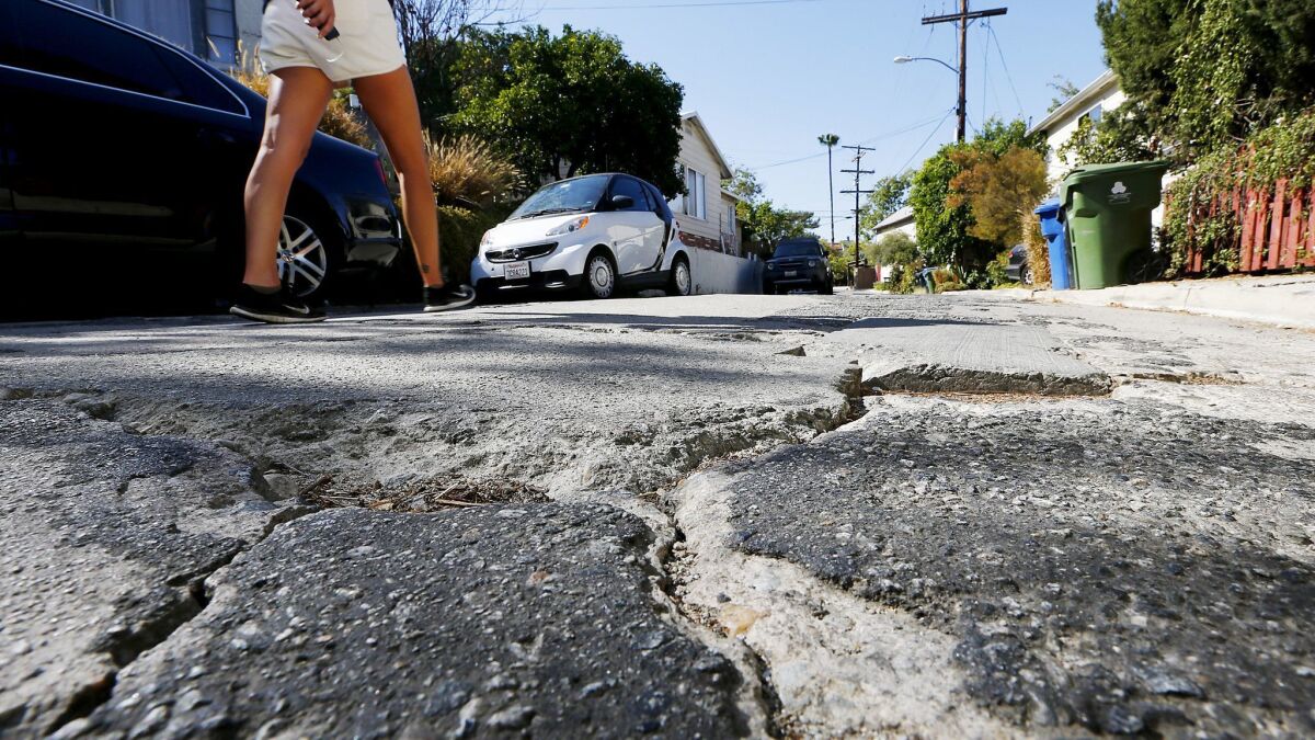 Part of the mayor’s new spending plan includes $73 million for reconstruction of the city’s worst streets. Crane Boulevard in Mount Washington is a deeply rutted street that lacks sidewalks.