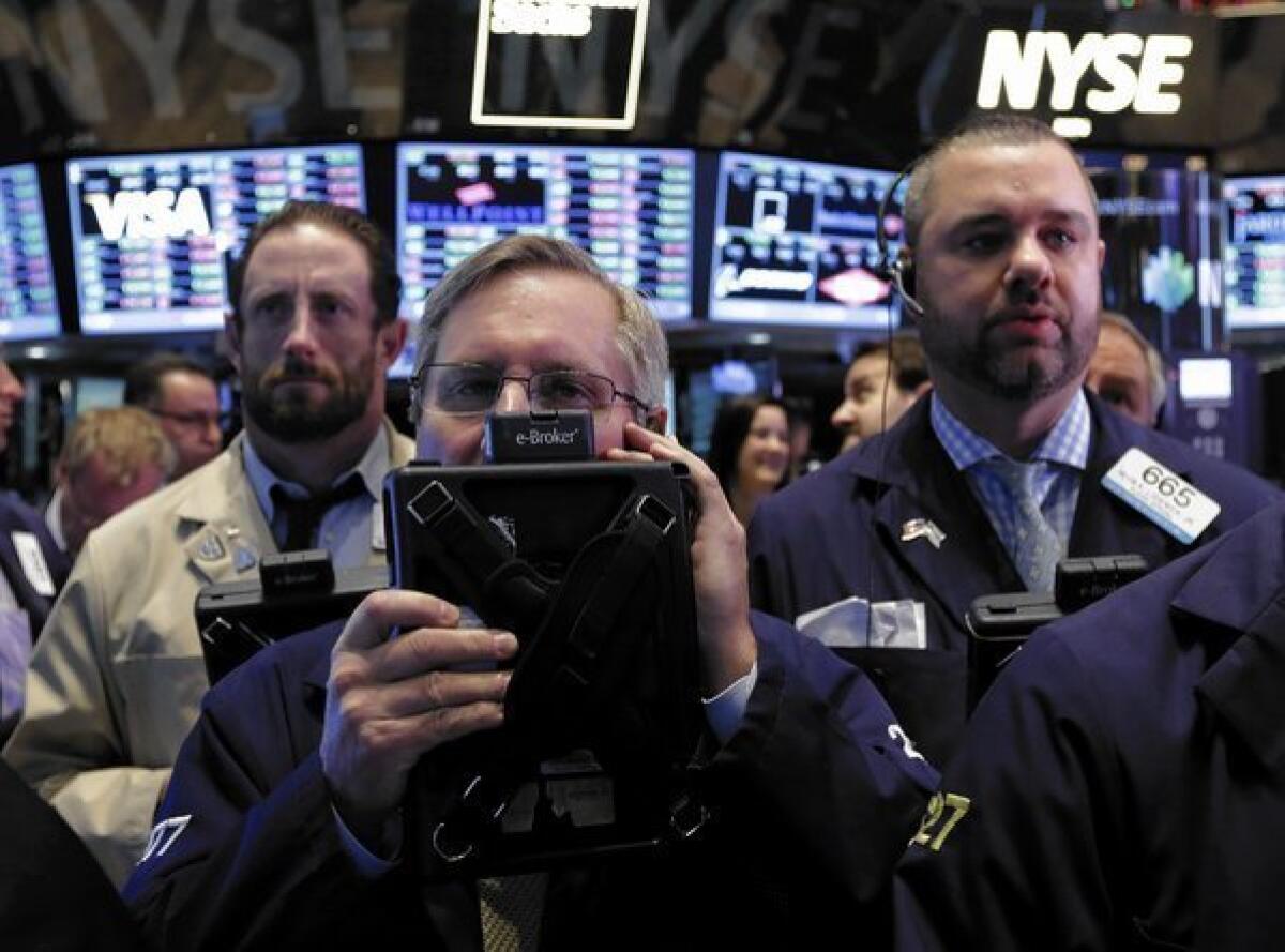 The stock sell-off comes on the heels of a powerful rally that has pushed the Dow up more than 20% this year. The broader Standard & Poor's 500 index is up 24.5% for 2013. Above, traders work on the floor of the New York Stock Exchange.