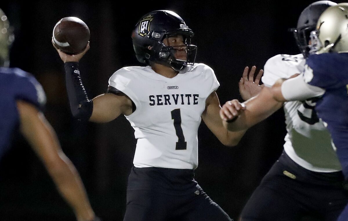 Servite quarterback Noah Fifita throws downfield.