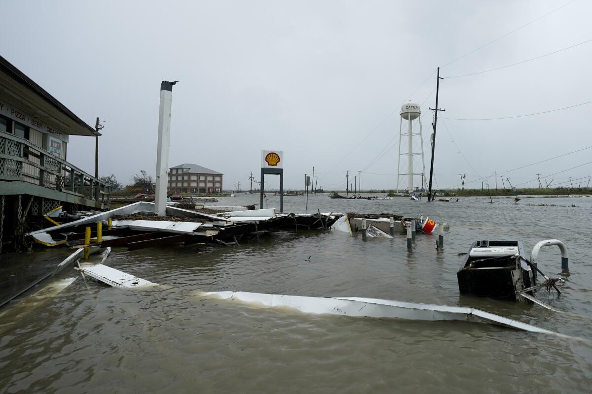 Flooding surrounds a damaged building Friday in Cameron, La.